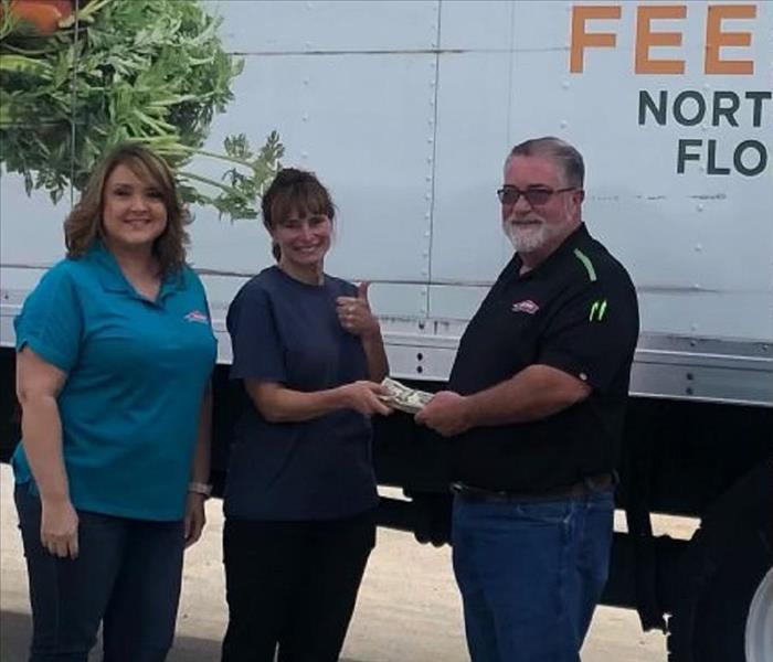 SERVPRO of Putnam County giving Epic Cure the proceeds from our 50/50 drawing. 